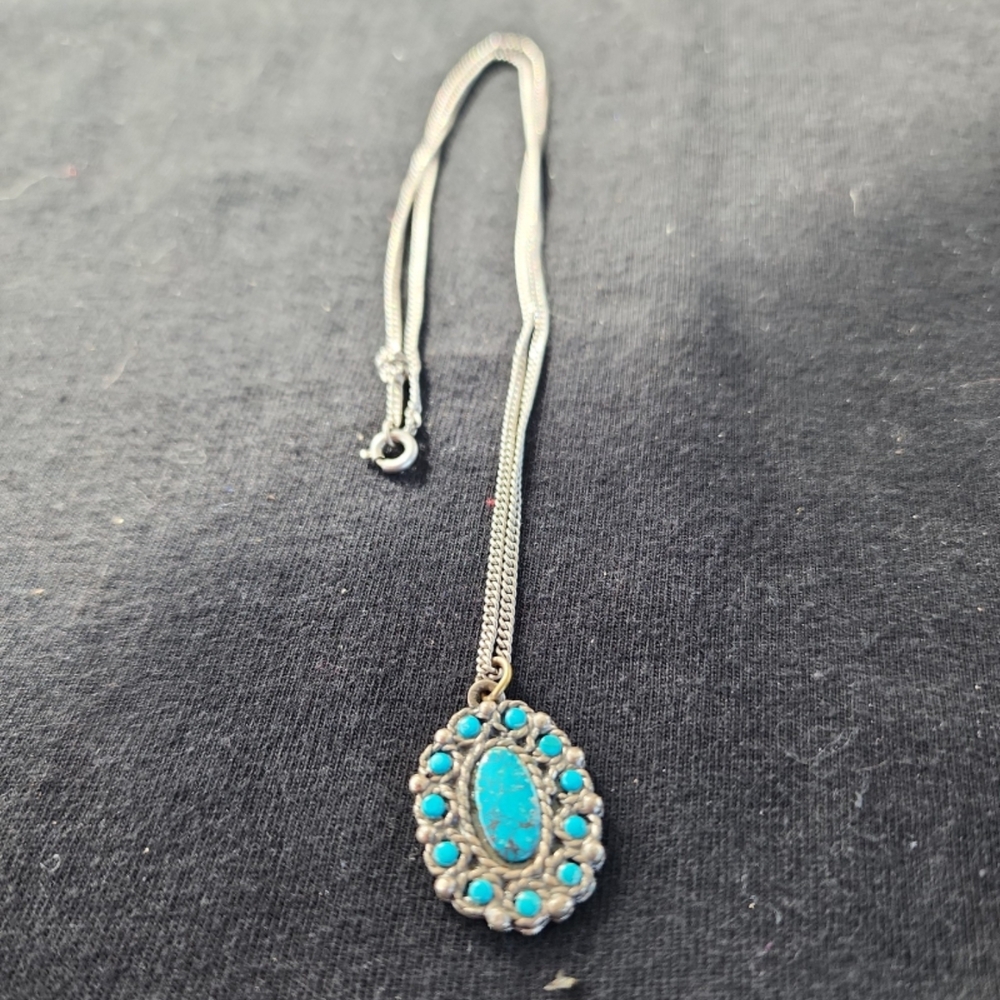 Sancrest silver necklace with a turquoise pendant.